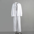 White long-sleeve button-down shirt and matching drawstring trousers on a clear mannequin.